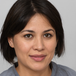 Joyful white adult female with medium  brown hair and brown eyes