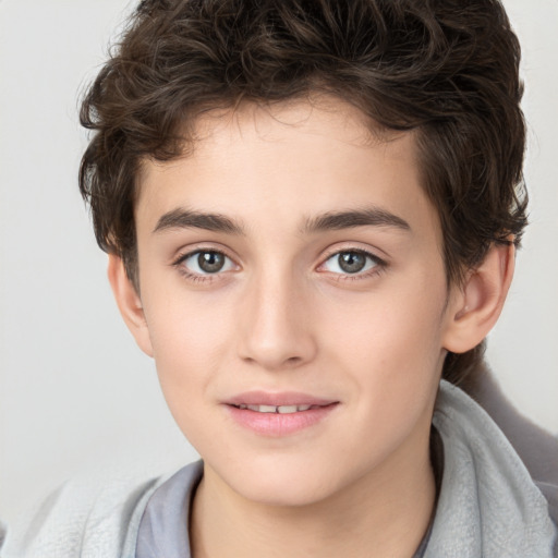 Joyful white child male with short  brown hair and brown eyes