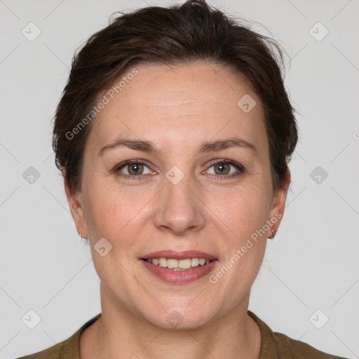 Joyful white adult female with short  brown hair and grey eyes