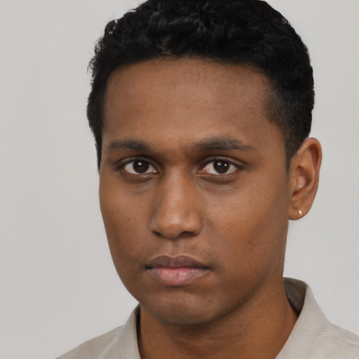 Neutral black young-adult male with short  black hair and brown eyes