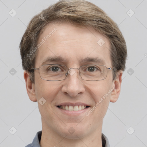 Joyful white adult male with short  brown hair and grey eyes