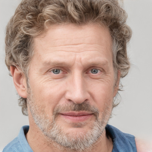 Joyful white middle-aged male with short  brown hair and grey eyes