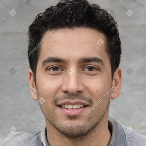 Joyful white young-adult male with short  black hair and brown eyes