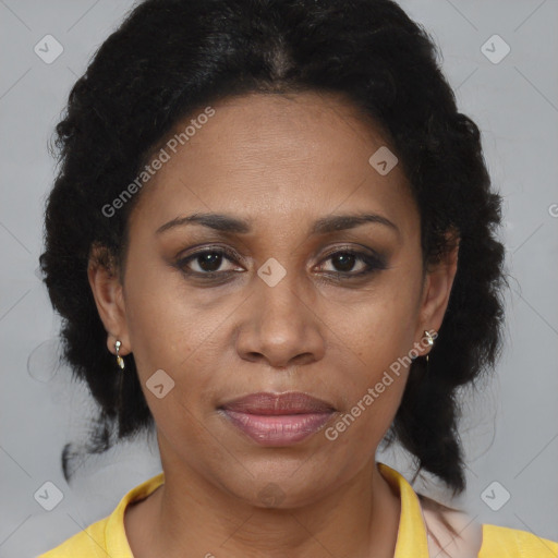 Joyful black adult female with medium  brown hair and brown eyes