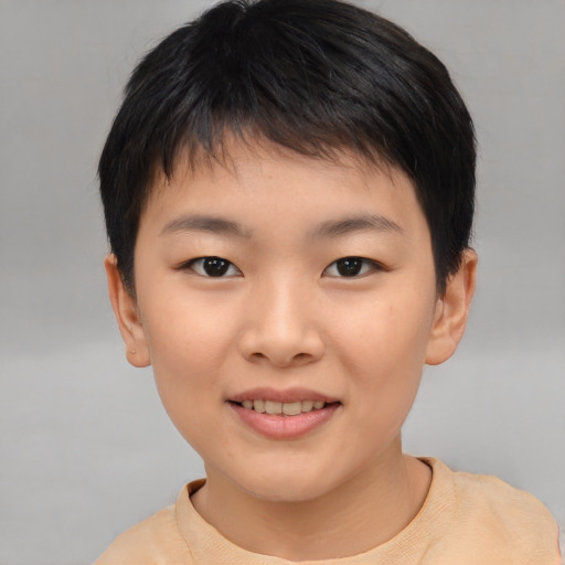 Joyful asian child female with short  brown hair and brown eyes