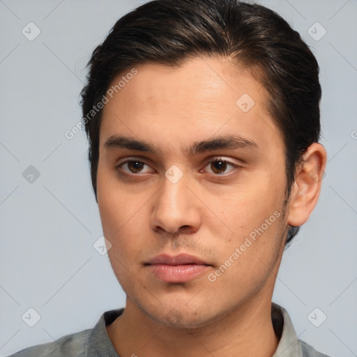 Neutral white young-adult male with short  brown hair and brown eyes