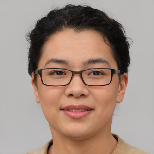 Joyful asian young-adult female with short  brown hair and brown eyes