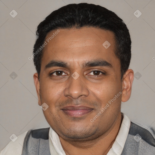 Joyful black adult male with short  black hair and brown eyes