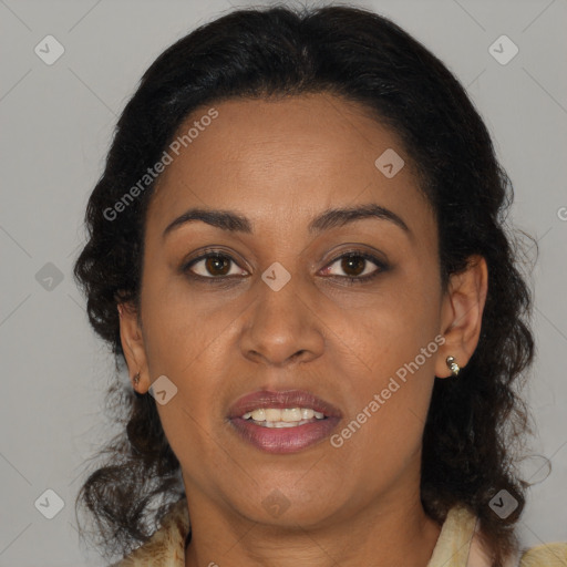 Joyful black adult female with medium  brown hair and brown eyes