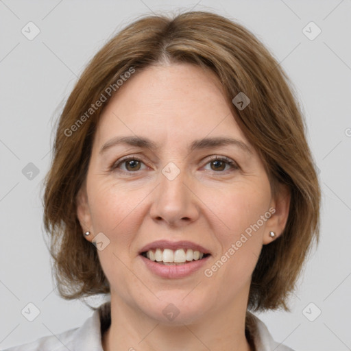 Joyful white adult female with medium  brown hair and grey eyes