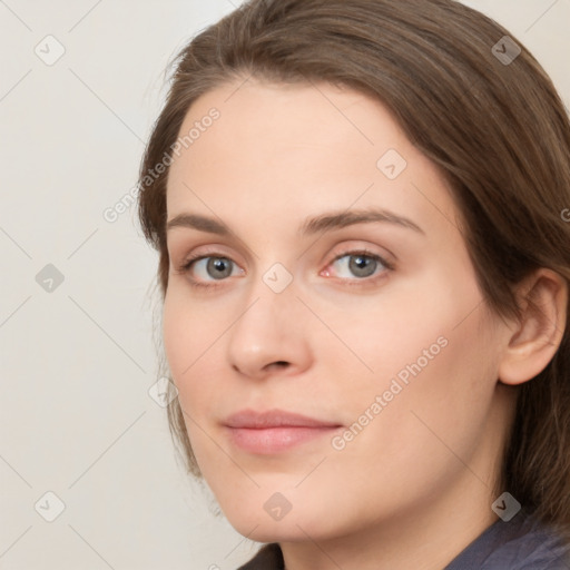 Neutral white young-adult female with medium  brown hair and grey eyes