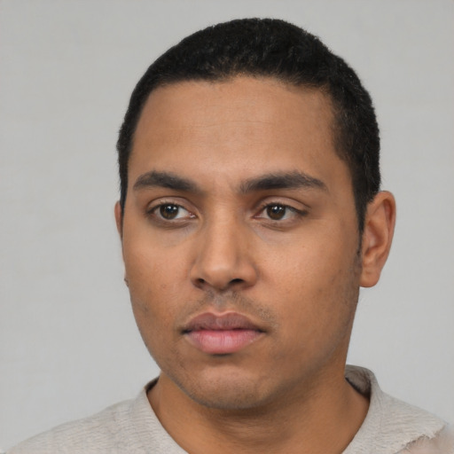 Neutral latino young-adult male with short  black hair and brown eyes