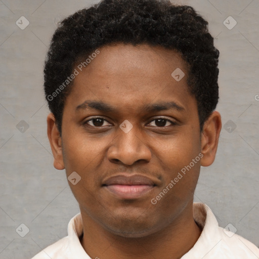 Joyful black young-adult male with short  brown hair and brown eyes