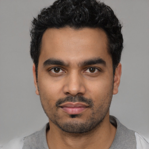 Neutral latino young-adult male with short  black hair and brown eyes