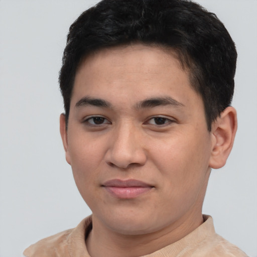 Joyful asian young-adult male with short  brown hair and brown eyes