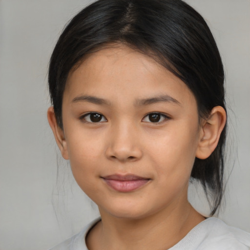 Joyful latino child female with medium  brown hair and brown eyes