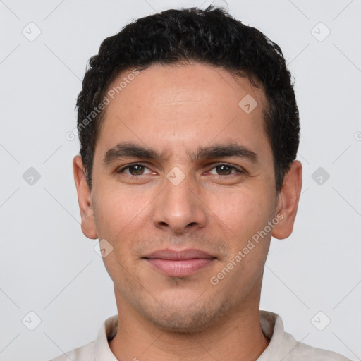 Joyful white young-adult male with short  black hair and brown eyes