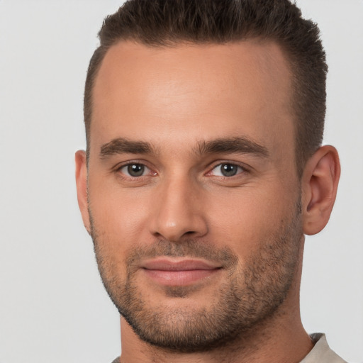 Joyful white young-adult male with short  brown hair and brown eyes