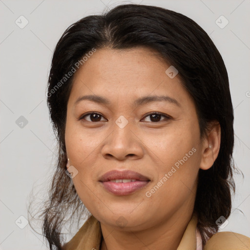 Joyful asian adult female with medium  brown hair and brown eyes