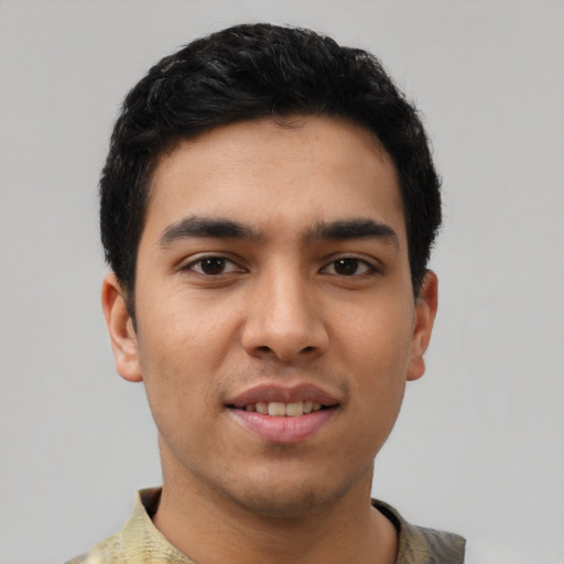 Joyful latino young-adult male with short  black hair and brown eyes