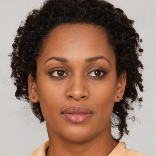 Neutral black young-adult female with long  brown hair and brown eyes