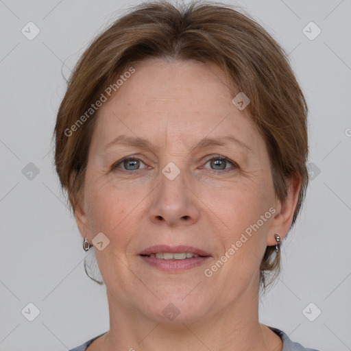 Joyful white adult female with medium  brown hair and grey eyes