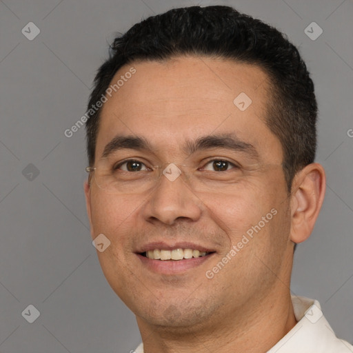 Joyful white adult male with short  black hair and brown eyes