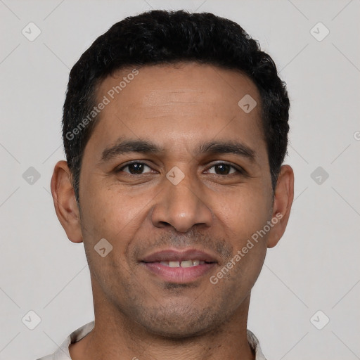 Joyful white young-adult male with short  black hair and brown eyes