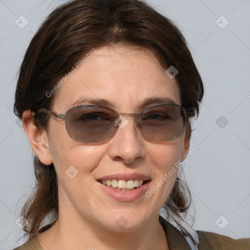 Joyful white young-adult female with medium  brown hair and blue eyes