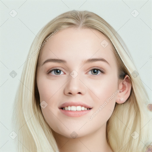 Joyful white young-adult female with long  brown hair and blue eyes