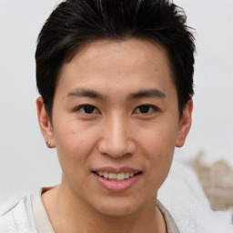 Joyful asian young-adult male with short  brown hair and brown eyes