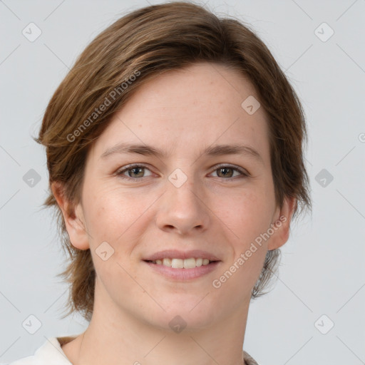 Joyful white young-adult female with medium  brown hair and grey eyes