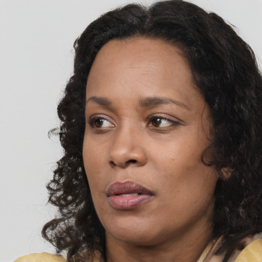 Neutral black adult female with long  black hair and brown eyes