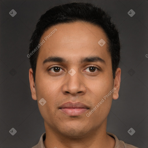 Joyful latino young-adult male with short  black hair and brown eyes