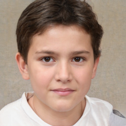 Joyful white child male with short  brown hair and brown eyes