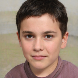 Joyful white child male with short  brown hair and brown eyes