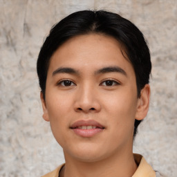 Joyful asian young-adult male with short  black hair and brown eyes