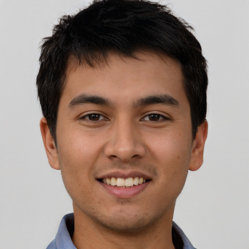 Joyful asian young-adult male with short  brown hair and brown eyes