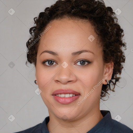 Joyful black young-adult female with medium  brown hair and brown eyes