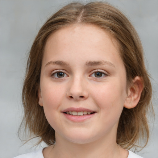 Joyful white child female with medium  brown hair and grey eyes