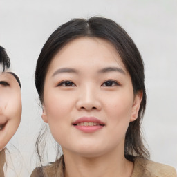 Joyful asian young-adult female with medium  black hair and brown eyes