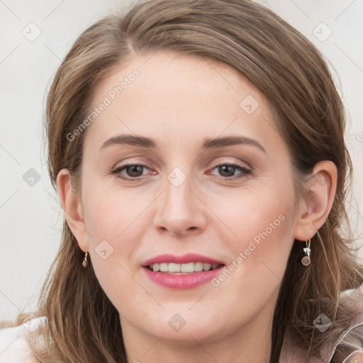 Joyful white young-adult female with long  brown hair and grey eyes