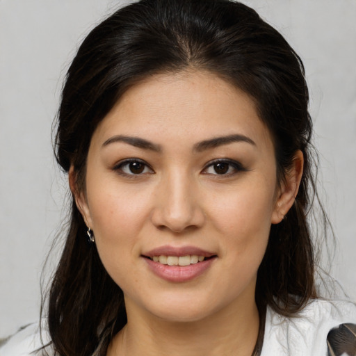 Joyful white young-adult female with medium  brown hair and brown eyes