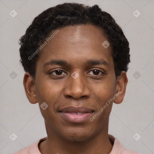 Joyful black young-adult male with short  brown hair and brown eyes