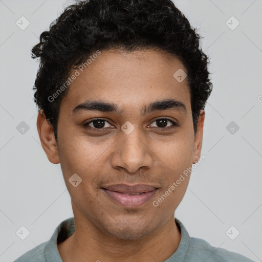 Joyful latino young-adult male with short  brown hair and brown eyes