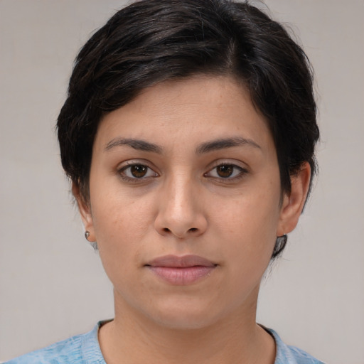 Joyful white young-adult female with medium  brown hair and brown eyes
