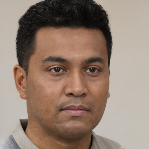 Neutral latino young-adult male with short  brown hair and brown eyes