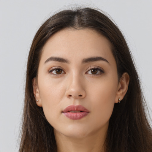 Neutral white young-adult female with long  brown hair and brown eyes