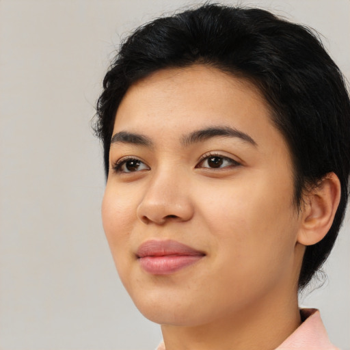 Joyful latino young-adult female with medium  black hair and brown eyes