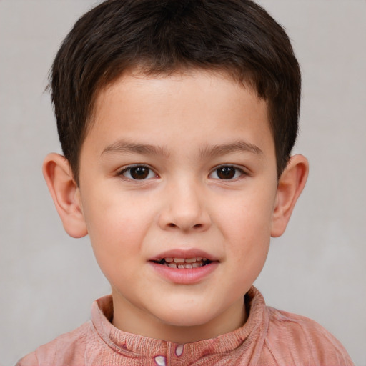 Joyful white child male with short  brown hair and brown eyes